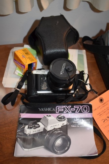 YASHICA FX-70 CAMERA, INCLUDES CASE, FILM AND BOOKLET