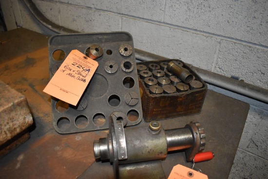 BOX AND STAND OF MISC. COLLETS AND COLLET MANUAL SPIN FIXTURE