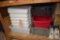 LOT OF PLASTIC BINS AND TUBS ON BOTTOM SHELF