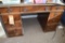 BROWN WOOD DESK WITH NINE DRAWERS, GLASS TOP,