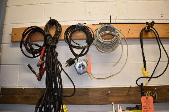 EXTENSION CORDS, WIRE AND PLUG HANGING ON NAILS