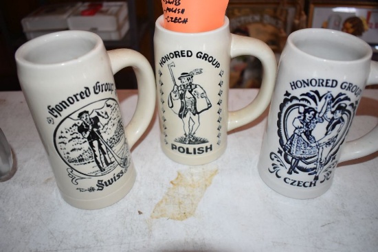 (3) HOLIDAY FOLK FAIR CERAMIC MUGS - SWISS, POLISH,