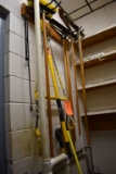 SQUEEGIES, YELLOW BRUSHES, SHOVEL AND MISC. HANGING ITEMS
