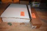 PILE OF CEILING TILE SQUARES AND CEILING GRID PARTS