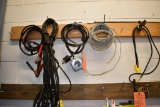 EXTENSION CORDS, WIRE AND PLUG HANGING ON NAILS
