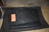 PILE OF RUBBER AND PLASTIC MATS
