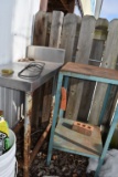 STAINLESS TABLE AND GREEN METAL TABLE