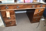 BROWN WOOD DESK WITH NINE DRAWERS, GLASS TOP,