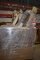 LARGE WOODEN CRATE WITH ASSORTED BOLTS OF FABRIC