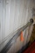 METAL BALING WIRE IN PVC PIPE, ATTACHED TO WALL -