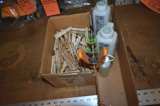 (2) BOXES WITH OIL AND CLOTHES PINS