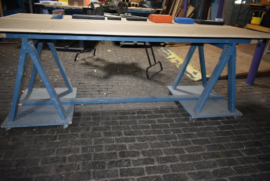 4' x 8' WOODEN WORK TABLE ON CASTERS, SAWHORSE STYLE BASE, NO CONTENTS - PICTURE IS REPRESENTATIVE