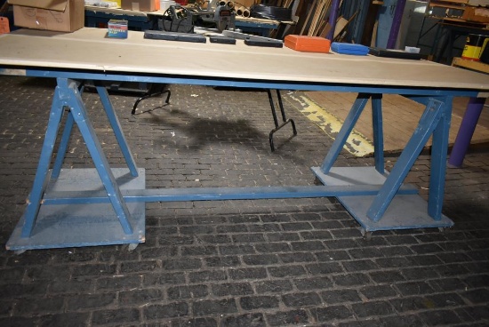 4' x 8' WOODEN WORK TABLE ON CASTERS, SAWHORSE STYLE BASE, NO CONTENTS - PICTURE IS REPRESENTATIVE