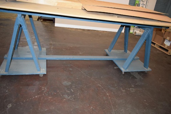 4' x 8' WOODEN WORK TABLE ON CASTERS, SAWHORSE STYLE BASE, NO CONTENTS