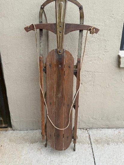 ANTIQUE WOOD AND METAL SLED WITH ROPE HANDLE, APPROX. 51" LONG, 21" STEERING HANDLE ACROSS END TO