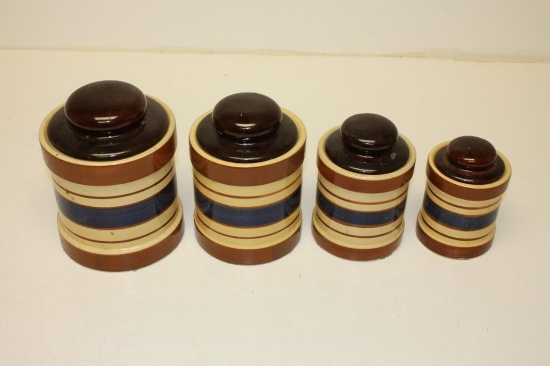 COMPLETE SET OF FOUR VINTAGE STONEWEAR COVERED CANISTERS (BROWN, TAN, BLUE)