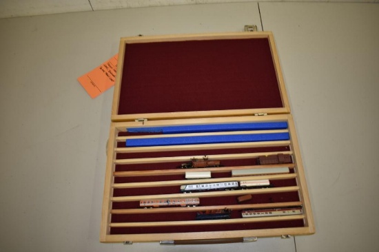 Brown wood car case, includes some train cars