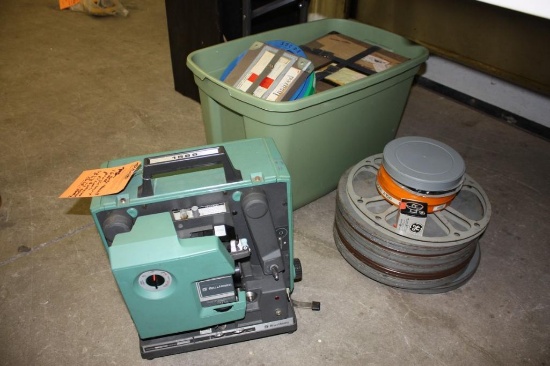 Complete vintage Bell & Howell 1585 16MM projector with extra bulb and films