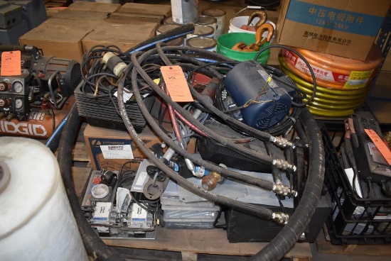(1) SKID OF CONTENTS: ELECTRIC MOTORS, HYDRAULIC HARNESS, UPS, TROUBLE LIGHTS, ETC
