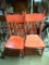 (2) RED MATCHING ANTIQUE CHAIRS WITH PRESS BACK