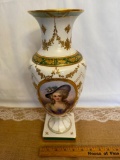 FLORAL GARLAND AND GILT DECORATED VASE WITH FEMALE WITH HAT, RIM HAS BEEN CRACKED