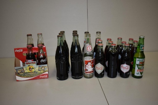 BOX WITH MISC COKE & PEPSI BOTTLES MOSTLY FULL