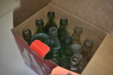 BOX WITH ASSORTED EMPTY COCA-COLA BOTTLES