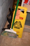 CAUTION SIGN, BROOM, DUST PANS AND ALL OTHER ITEMS BEHIND SHELF