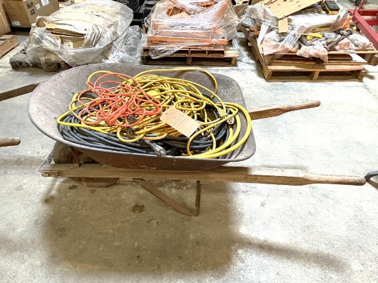 LARGE ASSORTMENT OF EXTENSION CORDS W/WHEELBARROW