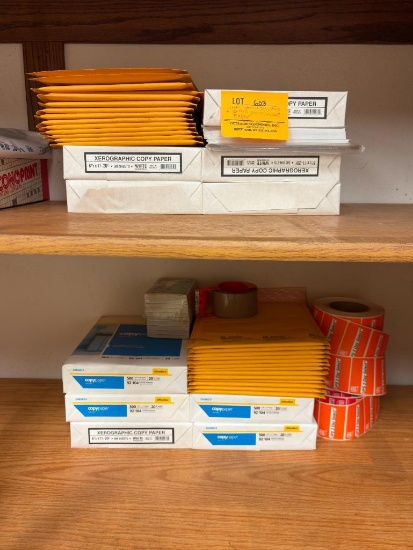 PLASTIC STENCIL SET, STACK OF BUBBLE MAILERS, COPY PAPER
