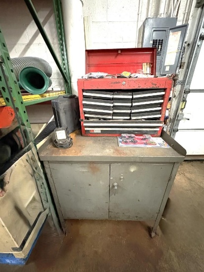 METAL TWO DOOR STORAGE CABINET WITH CONTENTS; RED TOOLBOX, TIE DOWNS, ETC.