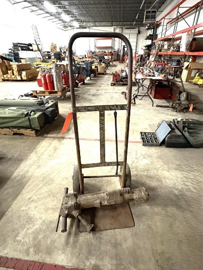 HAND TRUCK AND VINTAGE JACK HAMMER, MOST LIKELY OUT OF COMMISSION