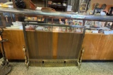 ELEGANT BRASS FIREPLACE SCREEN WITH MATCHING ANDIRONS, ORNATE BOTTOM TO THE SCREEN,