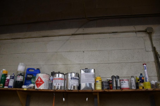 LARGE ASSORTMENT OF CHEMICALS ON THIS SHELF; STAIN, LUBRICANT, RESIN, ETC.
