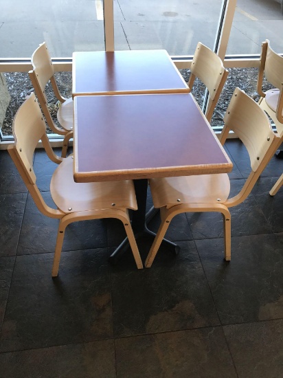 two tables with four chairs