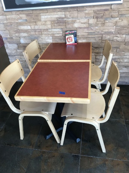 Two tables with four chairs