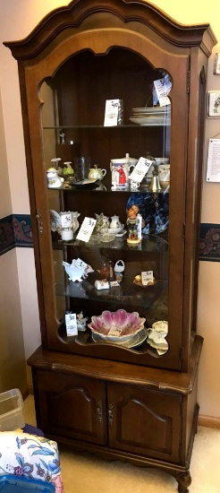 Lighted display case with cabinet on bottom