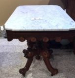 Ornate to marble top parlor table By Eastlake