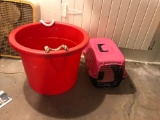 large bucket and small kennel