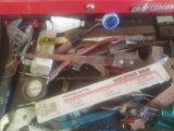 Tools in drawer: tire gauge, saw, plyers, etc