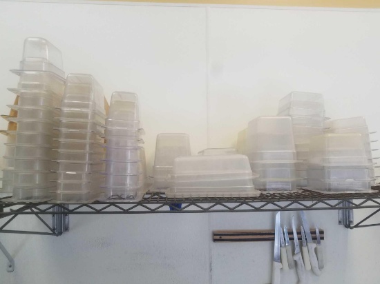 Full shelf of plastic buffet serving dishes