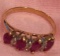 Small 5? 14 k gold ring with red and diamond colored stones