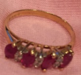 Small 5? 14 k gold ring with red and diamond colored stones
