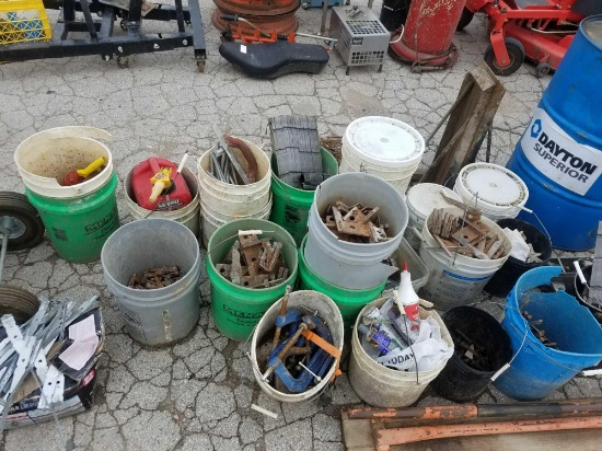 Multiple Buckets of Concrete form connectors and hand tools