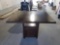 Dark walnut wood table with 12