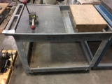 Plastic cart with 2 stone pieces & vice