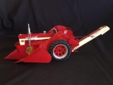 1/16th Ertl Farmall 560 with Corn Picker Precision Number 14 has been displayed with Medallion