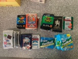 Baseball, football, hockey packs of cards unopened Approx 56