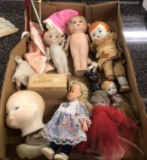 Empy plastic dolls and Old glass stir sticks