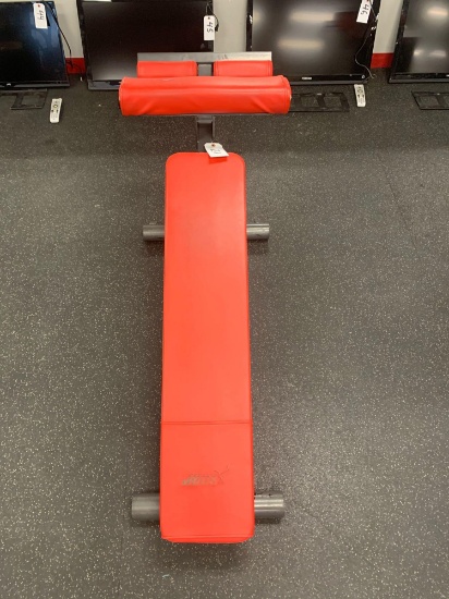 Cybex adjustable decline bench can use with free weights or abs